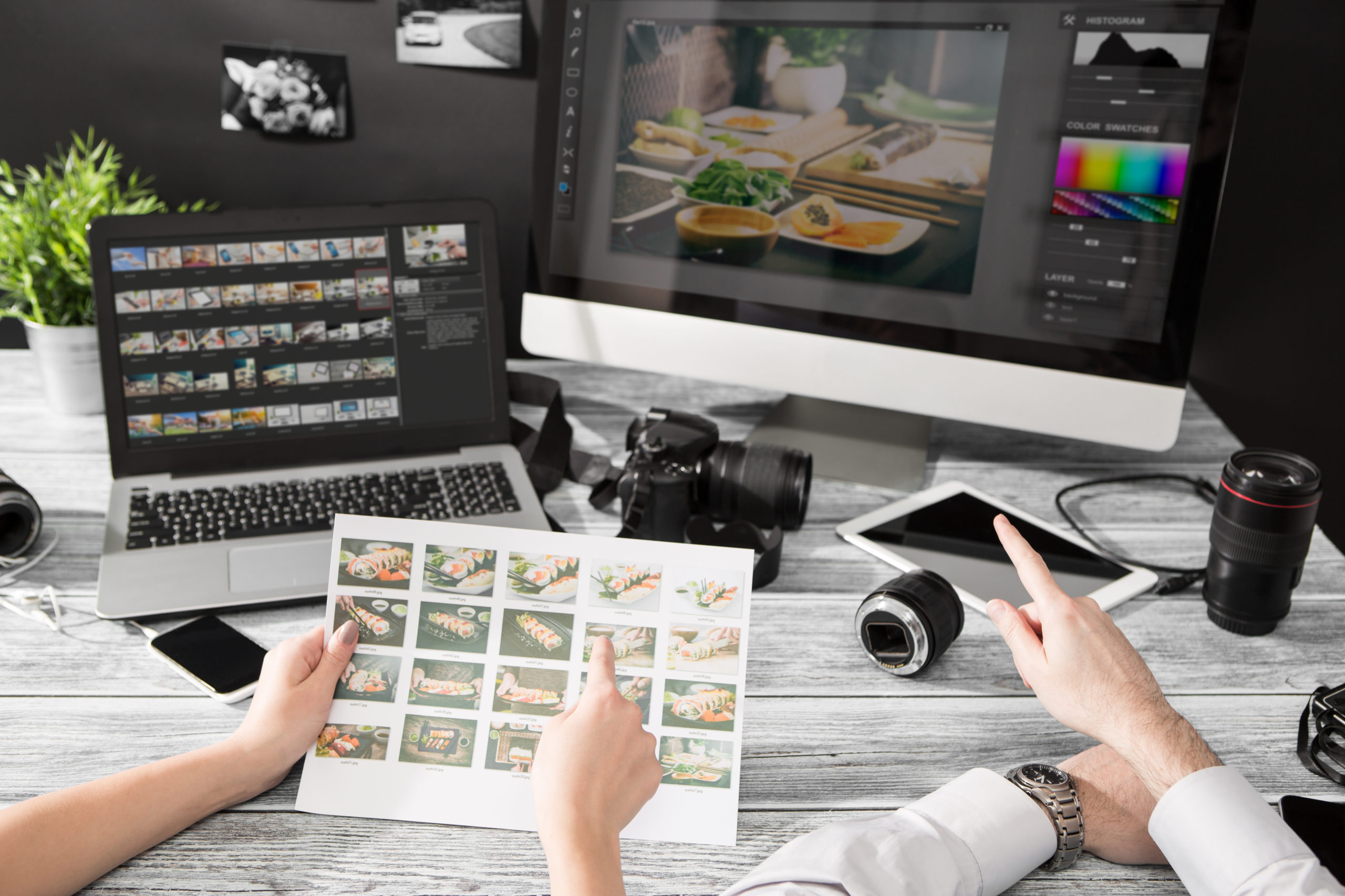 Photographers computer with photo edit programs.
